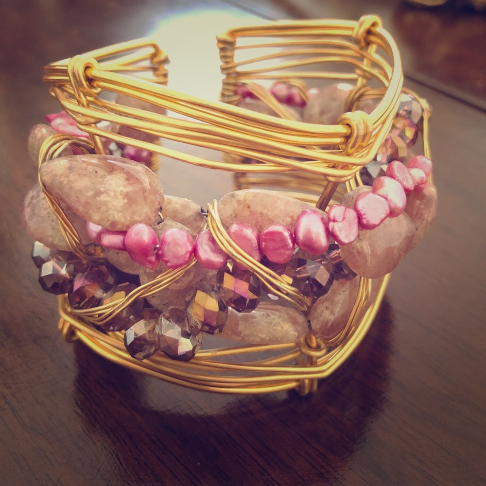 Gold bracelet with stone details